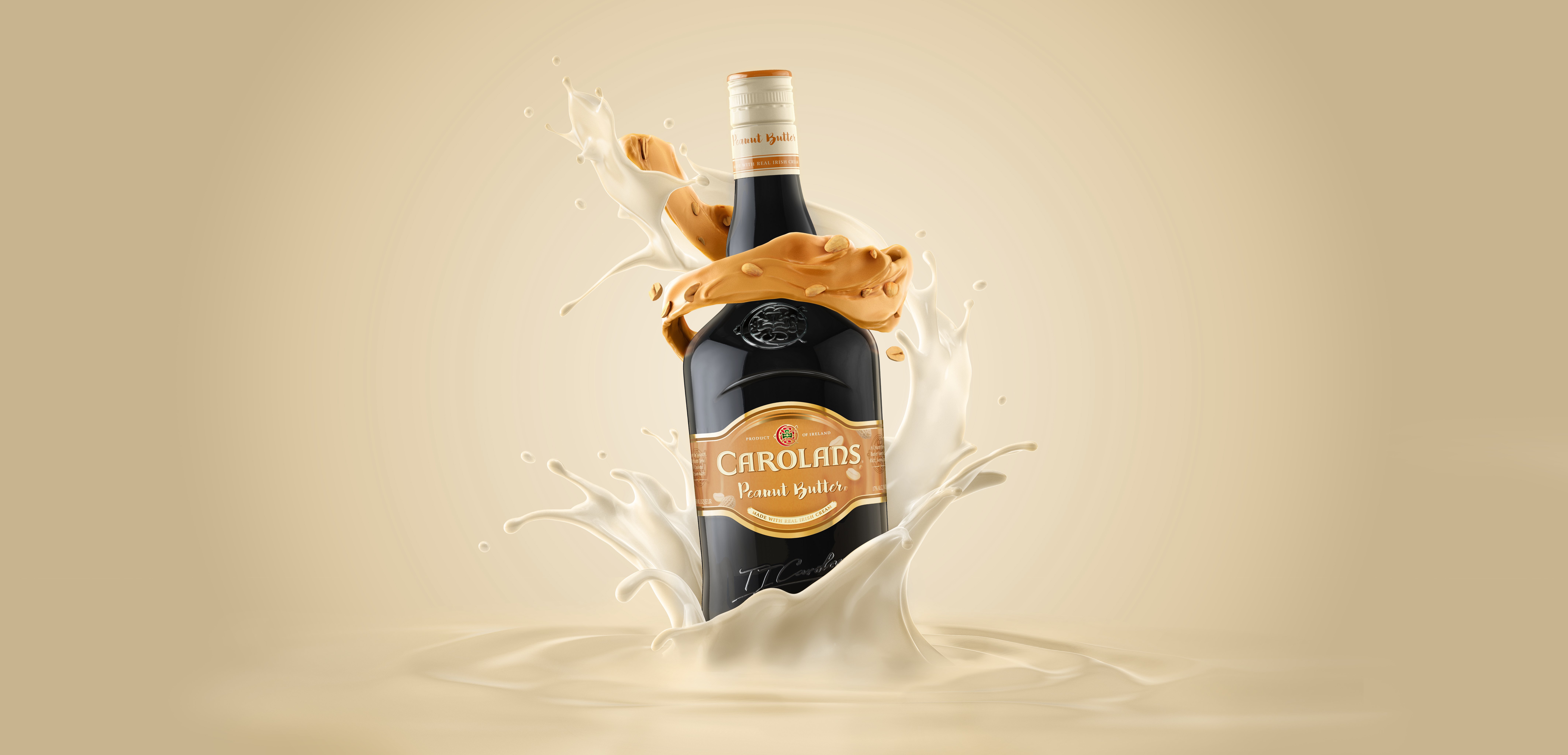 Carolans Irish Cream and Peanut Butter bottle is displayed splashing into fluid Irish cream with swirls of Irish cream and peanut butter working up the bottle.